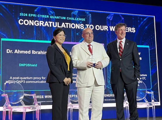 Dr. Ahmed Mohamed Ibrahim on stage receiving the 2026 EPRI Cyber Quantum Challenge award